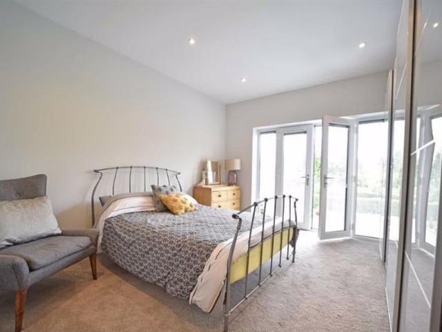 A large double room with french door and a Juliet balcony overlooking the back garden. There is a walk in cupboard with hanging space and shoe racks.