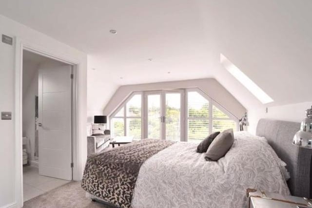 A commodious room with a vaulted ceiling, roof lights and french doors opening to a glass juliet balcony overlooking the rear garden. It has its own en suite shower room and dressing room.
