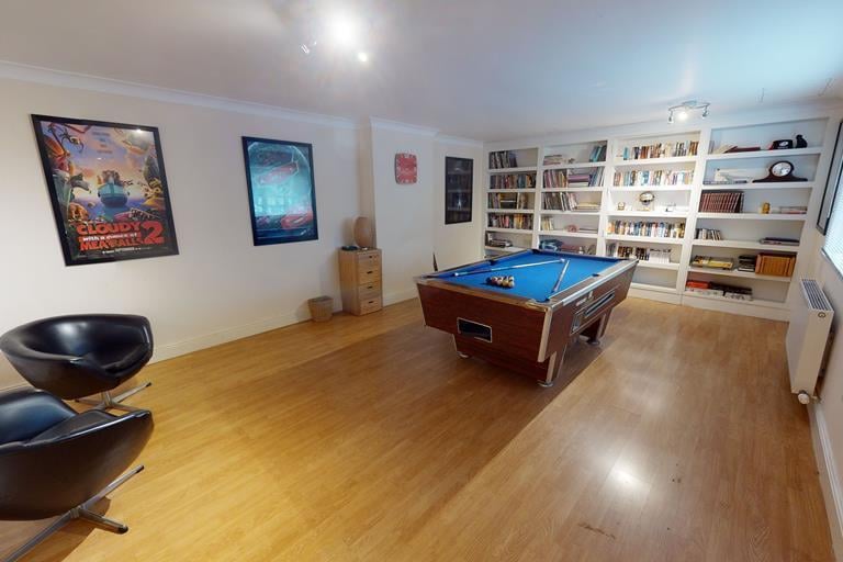This games room offers more space to play pool in comfort than most pubs
