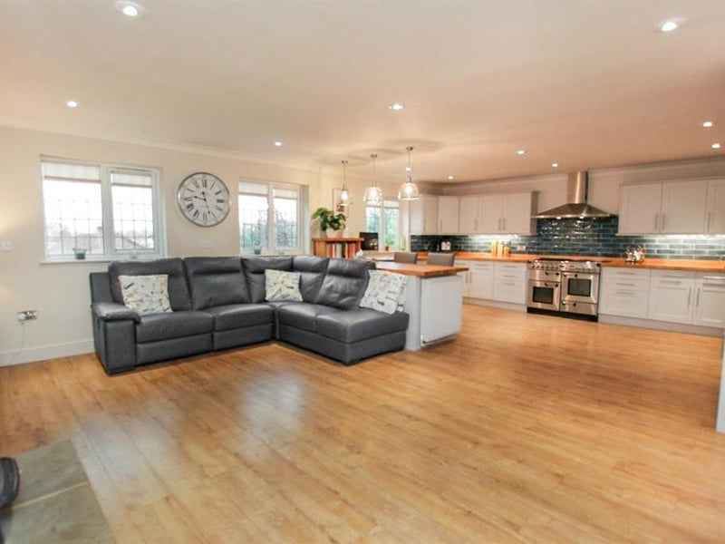 The spacious kitchen and dining room offers plenty of space to cook, eat and relax