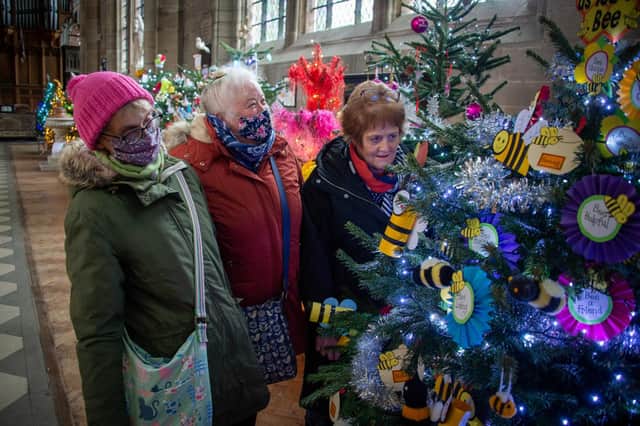 Gayle Harris, Janet Ball and Sandra Maclellan enjoying the Christmas tree festival in St Mary's Church