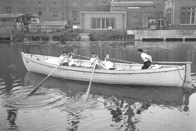 Sea Cadets row past Northampton Power Station, Midsummer Meadow from their Becket's Park base, September 3, 1957
