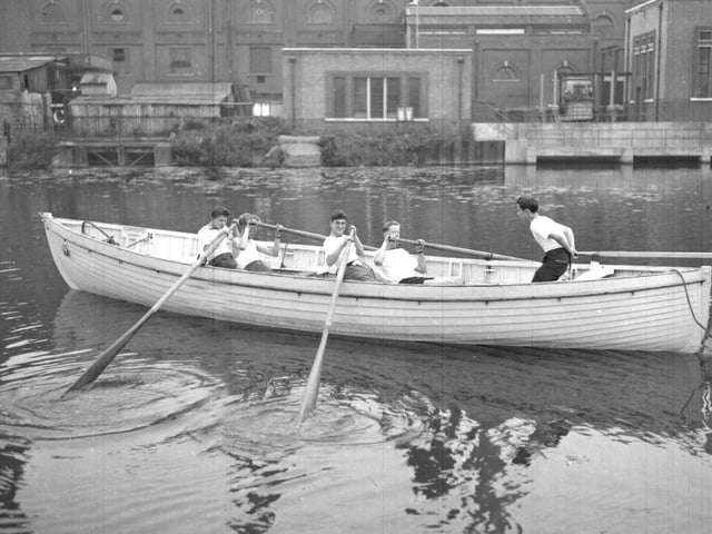 Sea Cadets row past Northampton Power Station, Midsummer Meadow from their Becket's Park base, September 3, 1957