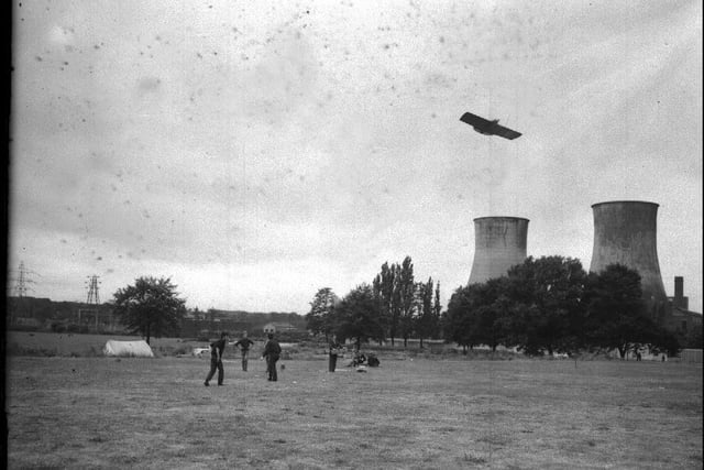 Model aircraft flying at Midsummer Meadow, Northampton, with cooling towers in background