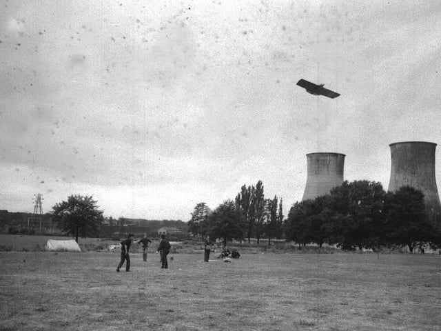 Model aircraft flying at Midsummer Meadow, Northampton, with cooling towers in background