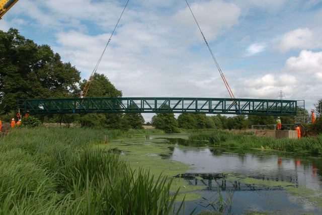 A new bridge goes into place in Midsummer Meadow, Bedford Road on Wednesday, 12th August 2009