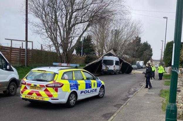 Police closed the road after the roof came off and landed on a van / Picture: Carl Eldridge