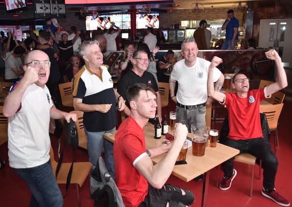England football fans watching the Ukraine game at  Coyotes Bar and Grill at New Road EMN-210307-221051009