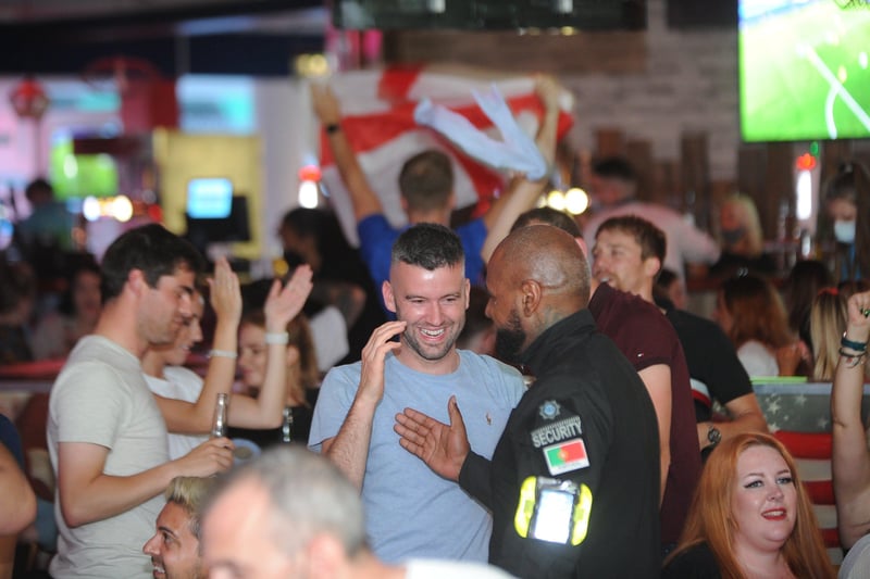 England football fans watching the Ukraine game at  Coyotes Bar and Grill at New Road EMN-210307-220934009
