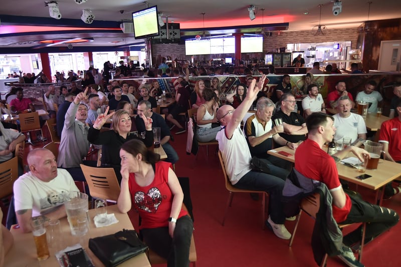England football fans watching the Ukraine game at  Coyotes Bar and Grill at New Road EMN-210307-221303009