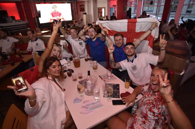 England football fans watching the Ukraine game at  Coyotes Bar and Grill at New Road EMN-210307-221325009