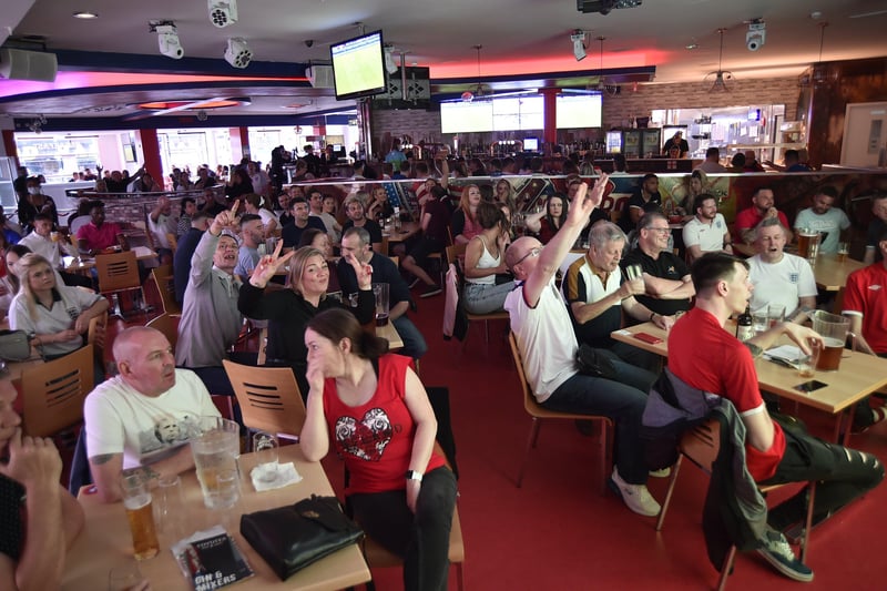 England football fans watching the Ukraine game at  Coyotes Bar and Grill at New Road EMN-210307-221303009
