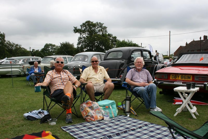 Picnicking by the classic cars. Picture by Graham Hazard