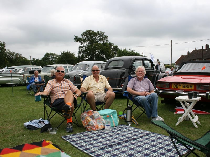 Picnicking by the classic cars. Picture by Graham Hazard