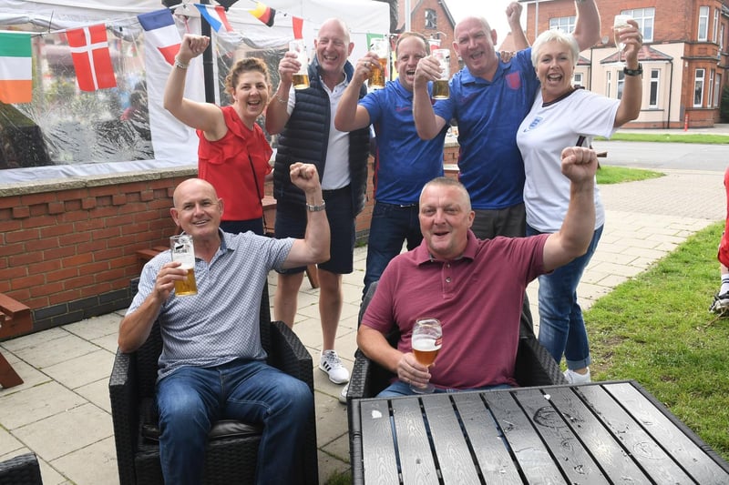 Ready to cheer on England at Churchills Wine & Sports Bar are (from left, front)  Andrew Storr and  Jason Curry: (from back) Dawn and Steve Radford, Dan Meik, John Miles and  Annette Monaghan.