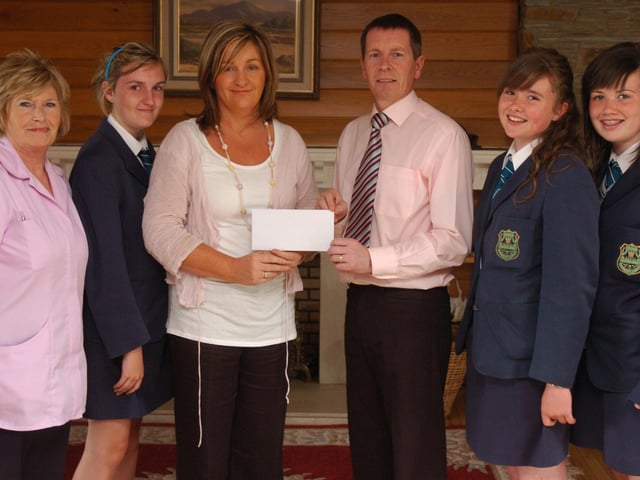 Students and staff from Thornhill College present the Foyle Hospice with a cheque for £907, money raised the recent female walk/run. Included, from left, Shiela Dobbins, Hospice nurse, Eimhear Duffy, Jacqueline Wallace, Noel McMonagle, community fundraiser, Maria Smith, and Hayley Deery. (2706PG60)