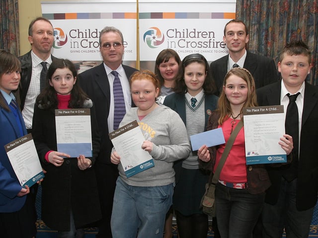 Crossfire 4601
Children from local school who contributed to the Children in Crossfire's book of award winning stories by budding young authors from throughout Northern Ireland, receiving certificates at the launch of the book held in The Broomhill Hotel. The children are (from left), Carla Mac Dee, St. Mary's College, Nicole Farrelly, St. Joseph's, Co. Donegal, Stacy Doherty, St. John's PS, Derry, Shauna Moore, Faughanvale PS, Catherine Lyons, Thornhill College, Rachel McIvor, Rosemount PS, and Markus Pleizier, St. Anne PS, Derry. Also included (back row), are Garbhan Downey, guest speaker, Richard Moore, Executive Director, Children in Crossfire, and Frank Diamond, Children in Crossfire.