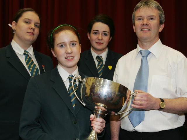 Thornhill College Irish Debating Team members Ceclia Mullin, Clare O'Hara and Nadine McColgan, winners of the Regional Grammar Schools debating competition held recently in the Central Library. Included in photo is irish teacher Fearghal MacUiginn. (0704JB32)