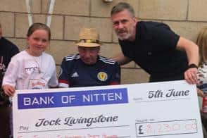 Jock receives the cheque.