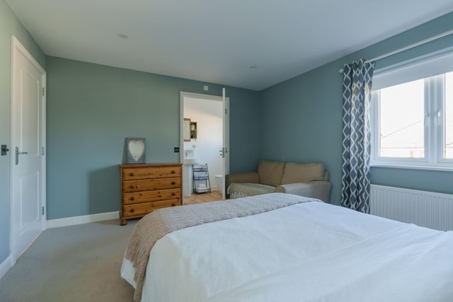 Bedroom two is a large double bedroom with an en-suite shower room.