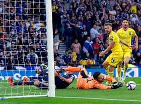 Scotland goalkeeper Craig Gordon makes another save at Hampden, but he was left exposed too often. Picture: Andrew Milligan/PA