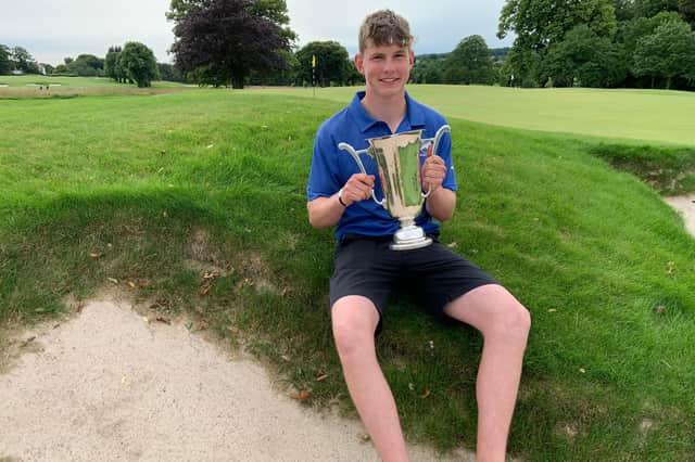 Edinburgh's Archie Finnie with the Scottish Boys’ Amateur Championship after his victory in the final at Bruntsfield Links. Picture: Scottish Golf