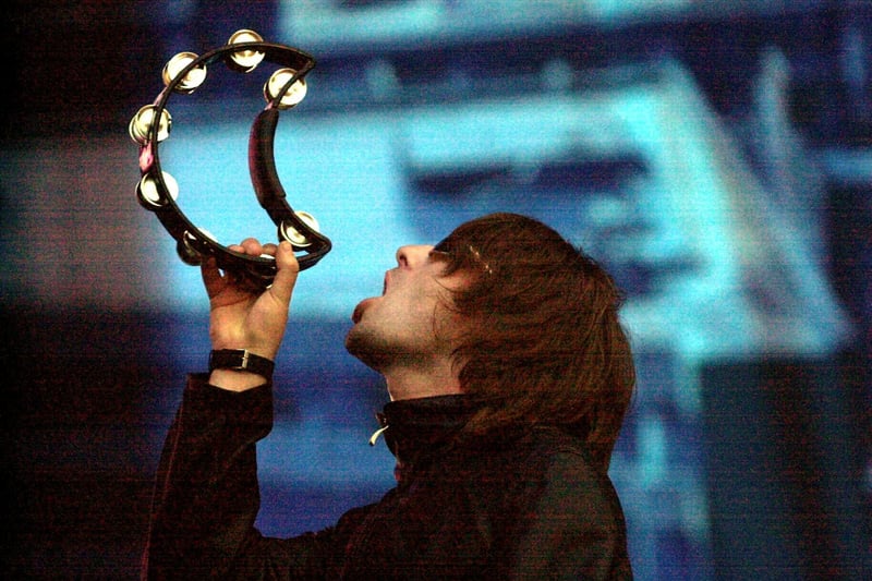 Liam Gallagher with his tambourine as Oasis performed a now legendary gig at Murrayfield Stadium on July 29, 2000.