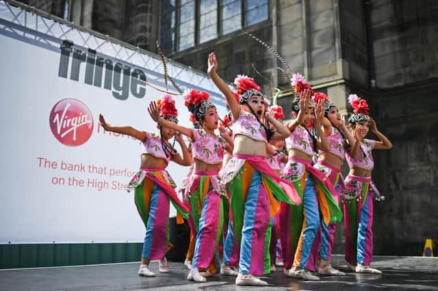 Edinburgh Festival Fringe entertainers perform on the Royal Mile in 2017. Picture: Jeff J Mitchell/Getty Images