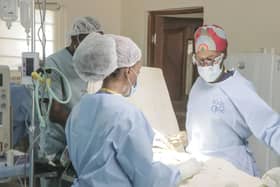 Dr Neema Kaseje (right) and a surgical team working in a KidsOR operating room.
