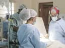 Dr Neema Kaseje (right) and a surgical team working in a KidsOR operating room.