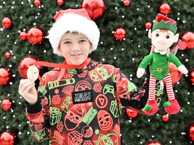 On completion of the walk, all children received a commemorative wooden keepsake medal and chocolate coins, presented by the management team at The Centre, Livingston who were joined at the event by an Elf character.