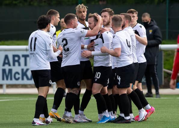 Danny Handling (centre) celebrates with his team mates after scoring for Edinburgh City in the play-off win over Elgin. (Photo by Ross Parker / SNS Group)
