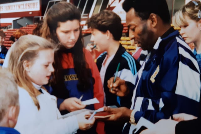 Pele giving autographs to girls from Craigmount High School during his visit to Tynecastle in 1989.