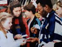 Pele giving autographs to girls from Craigmount High School during his visit to Tynecastle in 1989.