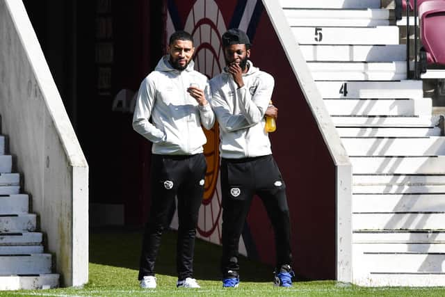 Former Hearts team-mates Josh Ginnelly and Beni Baningime prior to the match with St Mirren in April. Picture: SNS