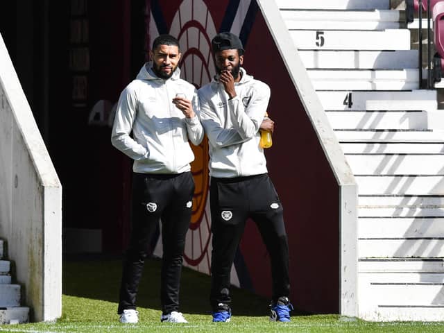 Former Hearts team-mates Josh Ginnelly and Beni Baningime prior to the match with St Mirren in April. Picture: SNS