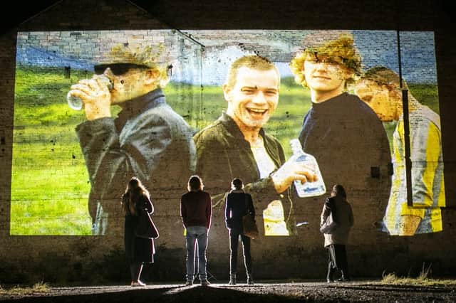 Images from the films Trainspotting and The Illusionist, both set in Edinburgh, are projected onto a derelict site by Double Take Projections in Leith, Edinburgh, during a test screening for Cinescapes.