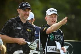 Stephen Gallacher talks tactics with his son/caddie Jack on the ninth tee in the second round of the Saudi International powered by SoftBank Investment Advisers at Royal Greens Golf and Country Club in King Abdullah Economic City. Picture: Ross Kinnaird/Getty Images.