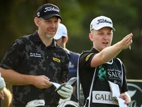 Stephen Gallacher talks tactics with his son/caddie Jack on the ninth tee in the second round of the Saudi International powered by SoftBank Investment Advisers at Royal Greens Golf and Country Club in King Abdullah Economic City. Picture: Ross Kinnaird/Getty Images.