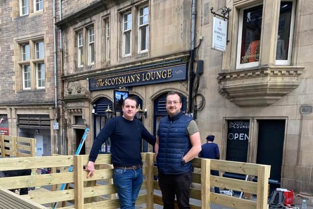 Landlords Daniel and Finbarr McNally take a short breather as work continues a pace to tear down and revamp a new outdoor seating area at the historical Scotsman Lounge in time to open when lockdown restrictions lift on Monday