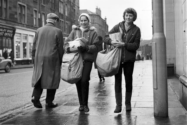Temporary Christmas postal workers Elizabeth Bennett and Jean Wilson on their rounds in Dalry Road in  Edinburgh in December 1967.