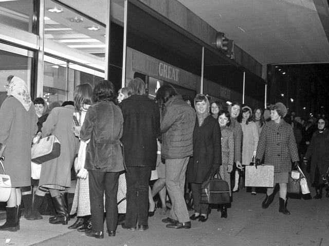 Shoppers queue outside C&A in Princes Street for the sales in December 1970