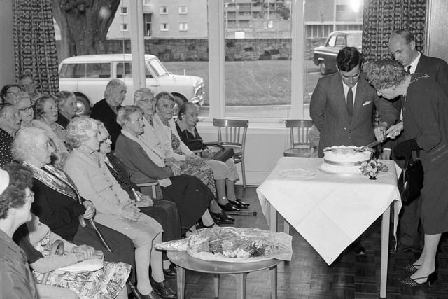 Lady Governor Mrs M Weatherstone cuts a cake presented to the Silverlea Old Age Home in Muirhouse Parkway in September 1963.