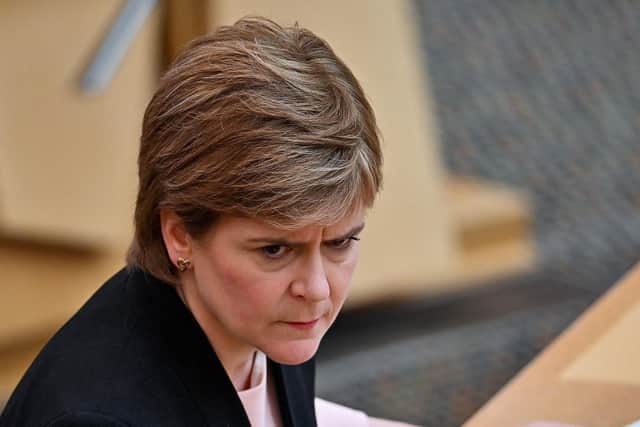 Nicola Sturgeon says she has not changed her story as Jason Leitch says football fans 'chose to ignore' government guidance. (Credit: Jeff J Mitchell/Pool'AFP/Getty)