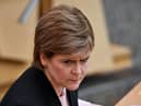 Nicola Sturgeon says she has not changed her story as Jason Leitch says football fans 'chose to ignore' government guidance. (Credit: Jeff J Mitchell/Pool'AFP/Getty)