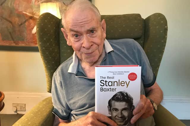 Stanley Baxter pictured recently with his new authorised biography at his home in London. Picture: David Holt