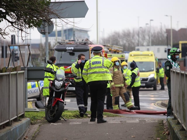 Police and fire crews wait at the scene of the house fire. Picture: Habibur Rahman