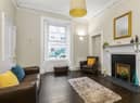 The property’s living room boasts many characterful original details
