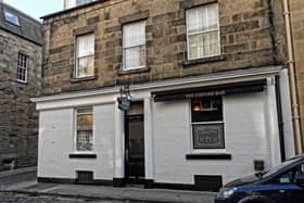 The Oxford Bar, which features in Edinburgh crime writer Ian Rankin's Inspector Rebus novels, has been named as one of the UK's ‘12 perfect pubs'.