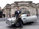 RSNO musicians Dávur Juul Magnussen and Emily Nenniger arrived in style at the Usher Hall to promote the event on Thursday, hitching a lift in 007’s iconic Aston Martin DB5. (Credit: Martin Shields)